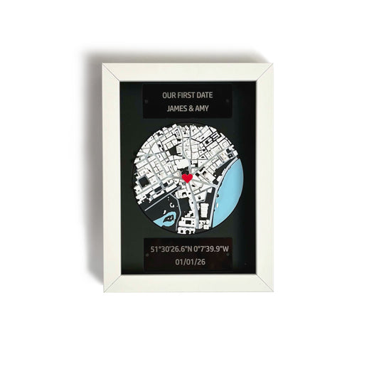Personalised 3D map frame with white frame, engraved plaques, and red heart pin marking a custom location.